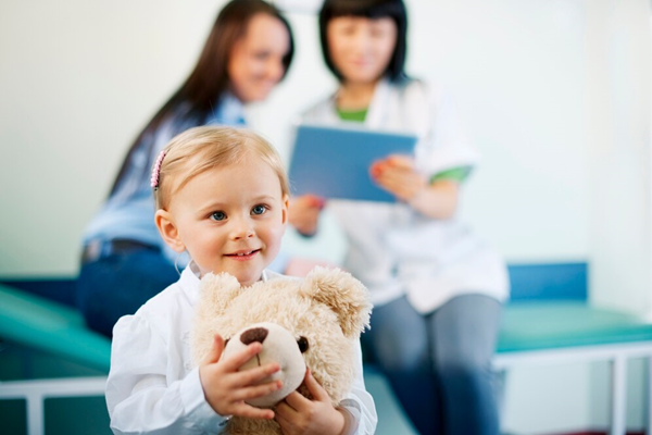 Doctor examining a baby