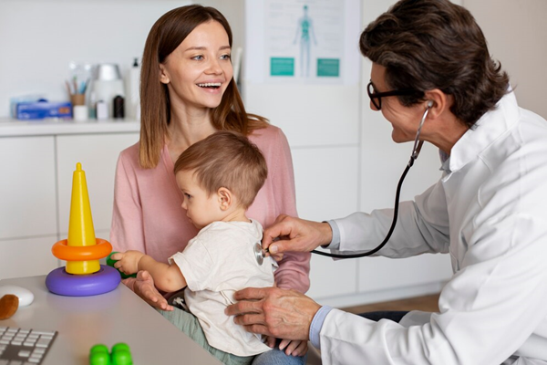 Doctor examining a child with toys